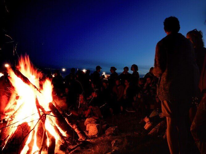 people around a bonfire
